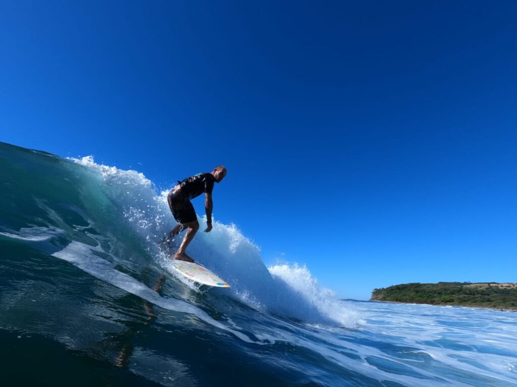 Offshore Vibes Surf School surfing under the blue sky