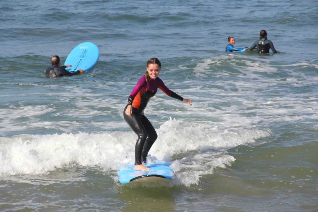 a girl taking a surfing class in Santa Monica